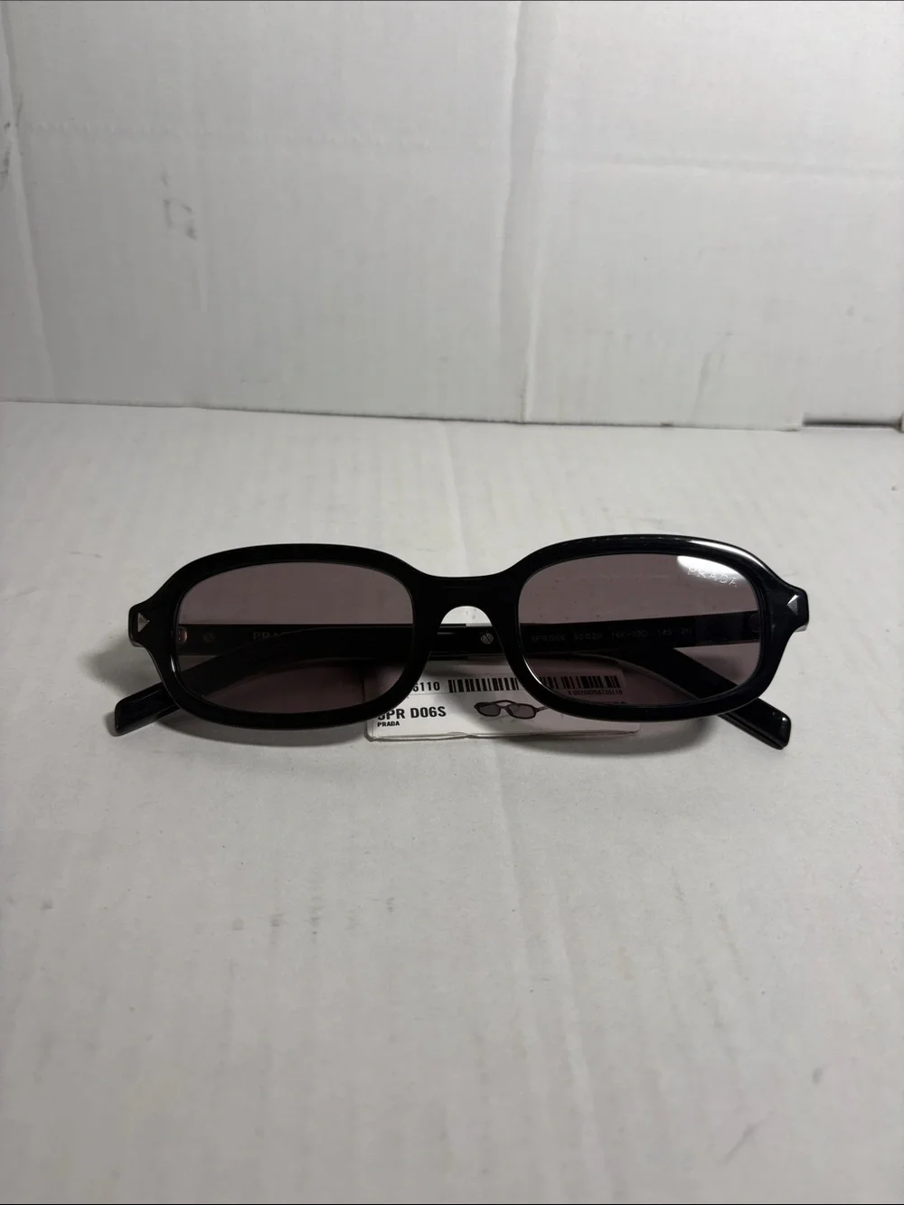 Prada 0PR Dogs Oval Frame Sunglasses in Black